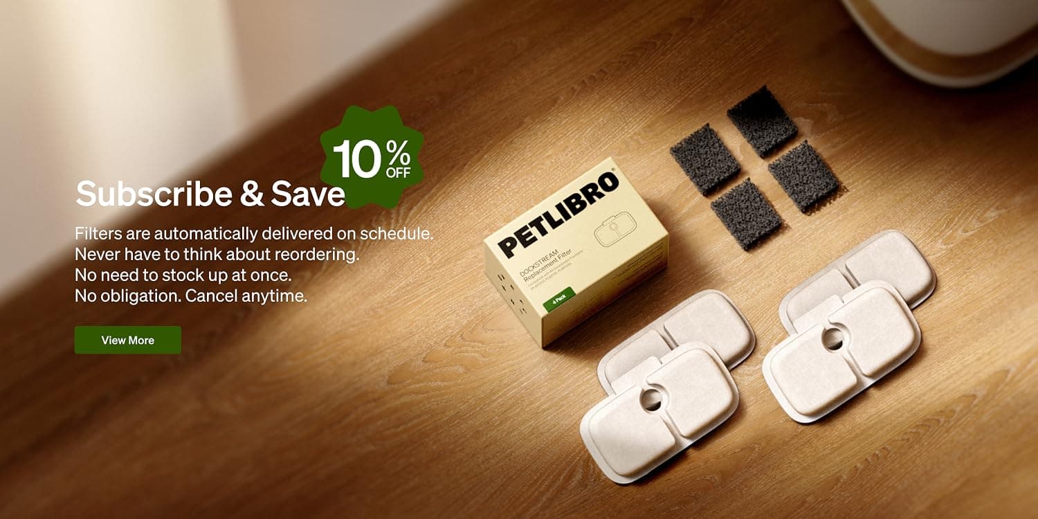 Dog and cat sitting beside a PETLIBRO smart feeder