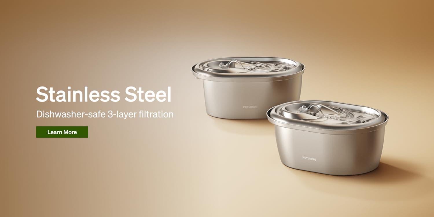 Dog and cat sitting beside a PETLIBRO smart feeder